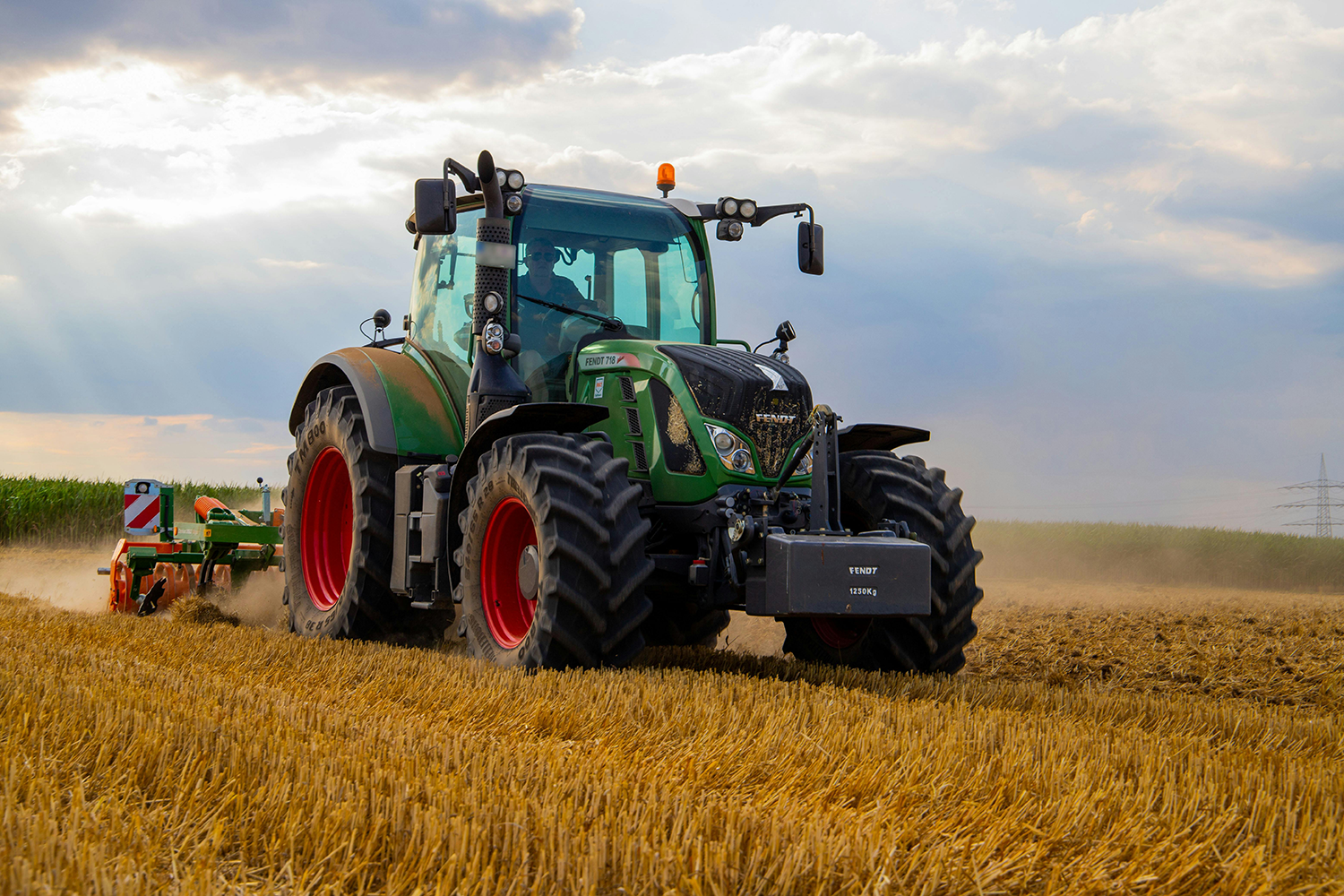 Farmer working in a green agricultural field