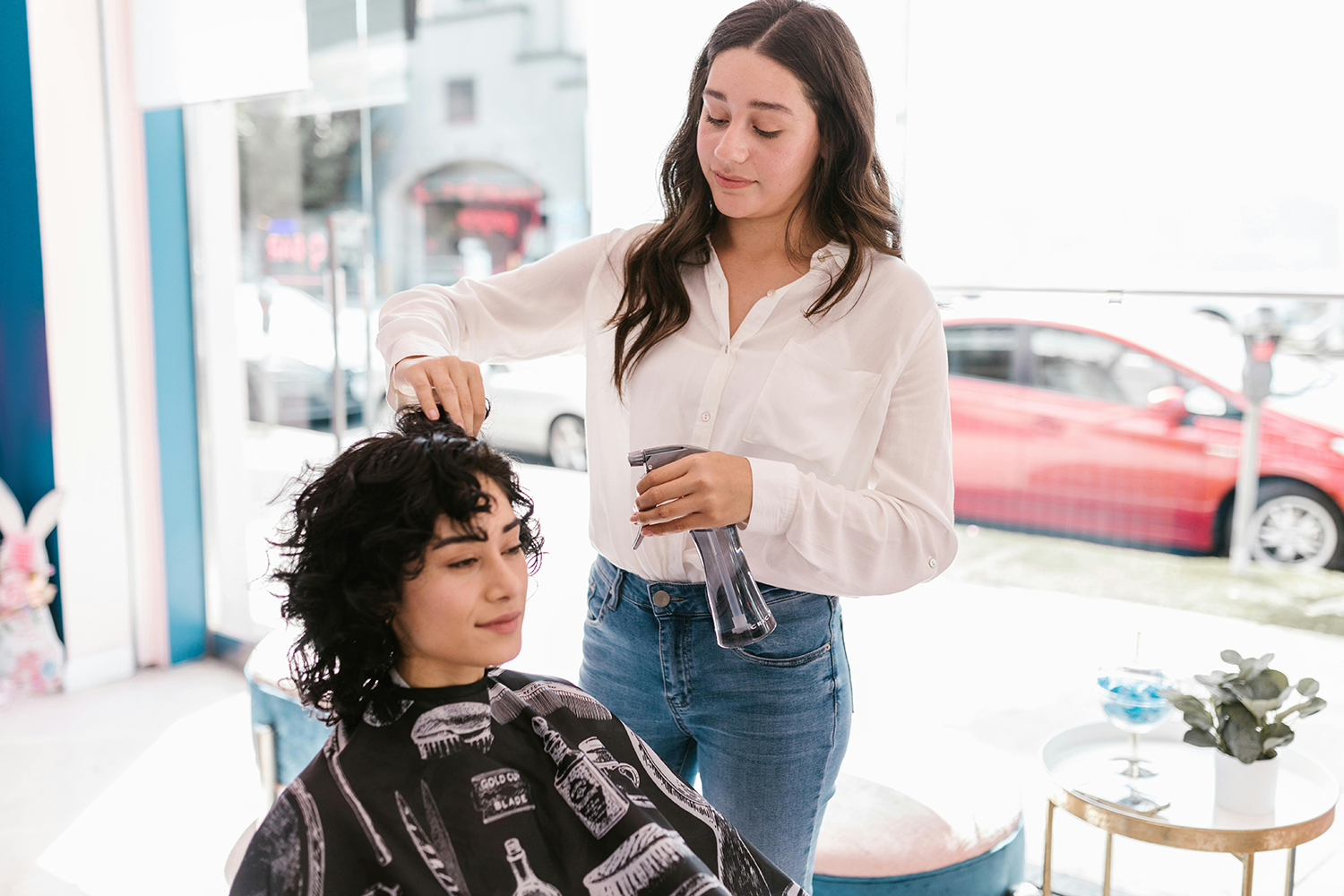 Stylist working with a client in a modern beauty salon